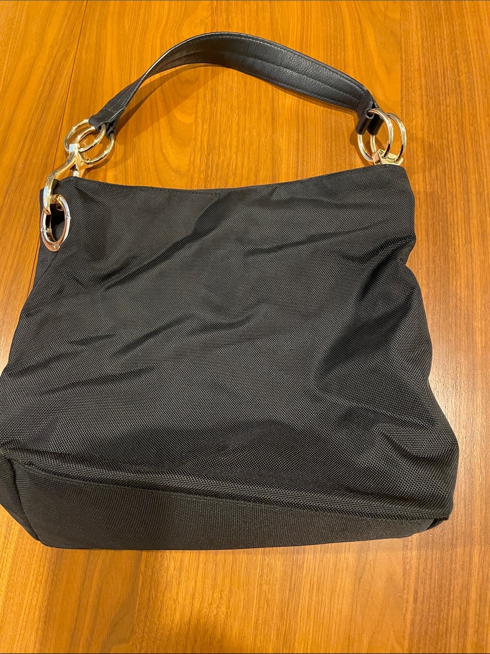 Elegant Black Shoulder Bag with Gold Rings